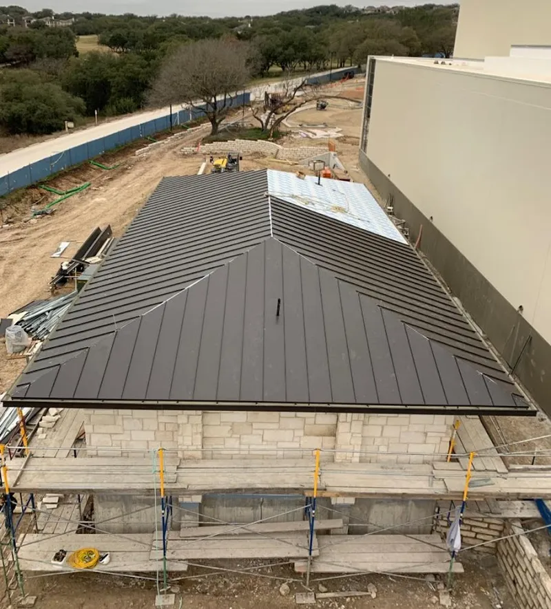 Metal roof new construction with scaffolding in Monee